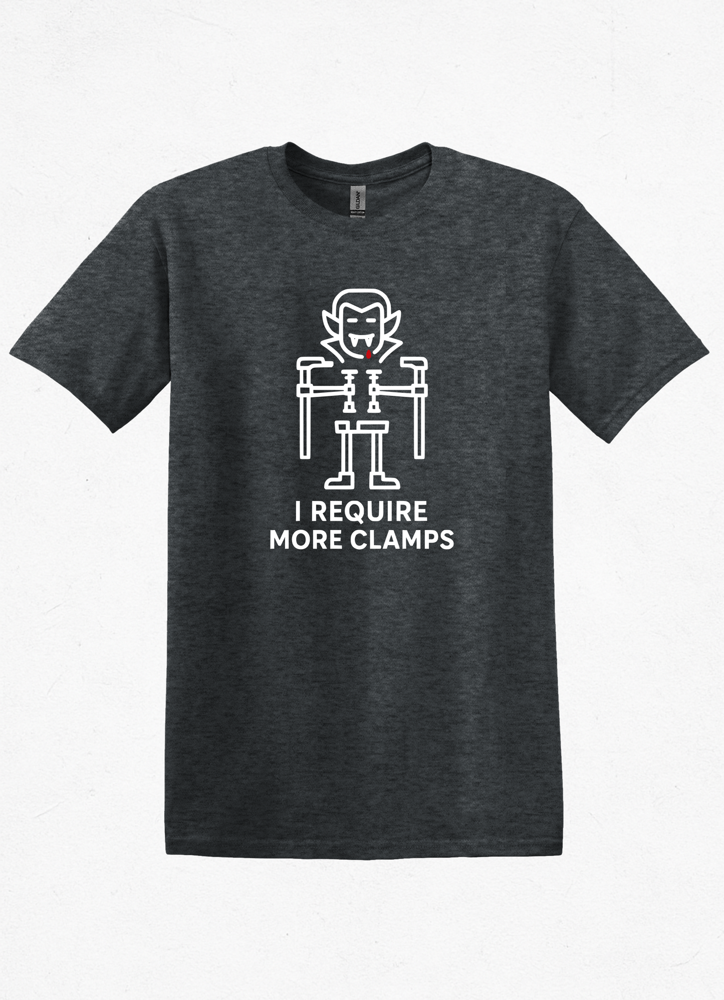 Flat lay of Clampire Halloween T-shirt. White clamp vampire graphic with text ‘I Require More Clamps’ on soft gray cotton tee.