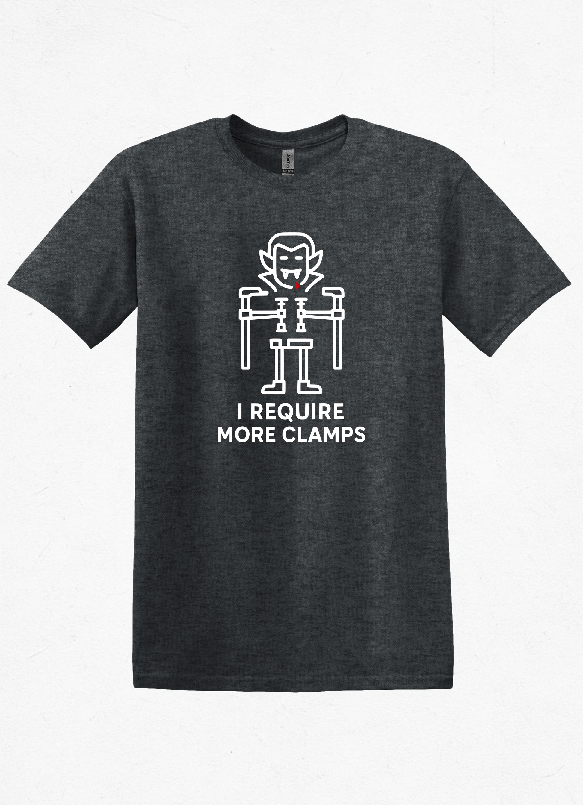 Flat lay of Clampire Halloween T-shirt. White clamp vampire graphic with text ‘I Require More Clamps’ on soft gray cotton tee.