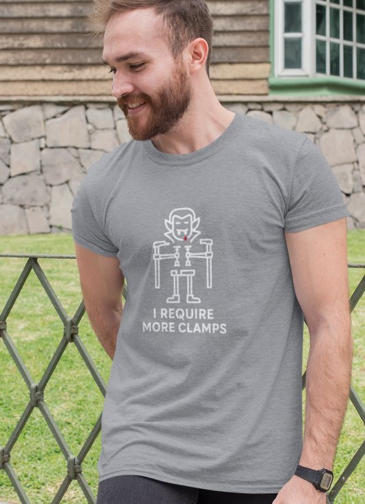 Clampire Halloween T-shirt featuring vampire made of F-style clamps with slogan ‘I Require More Clamps.’ White line art on grey Gildan 64000.”