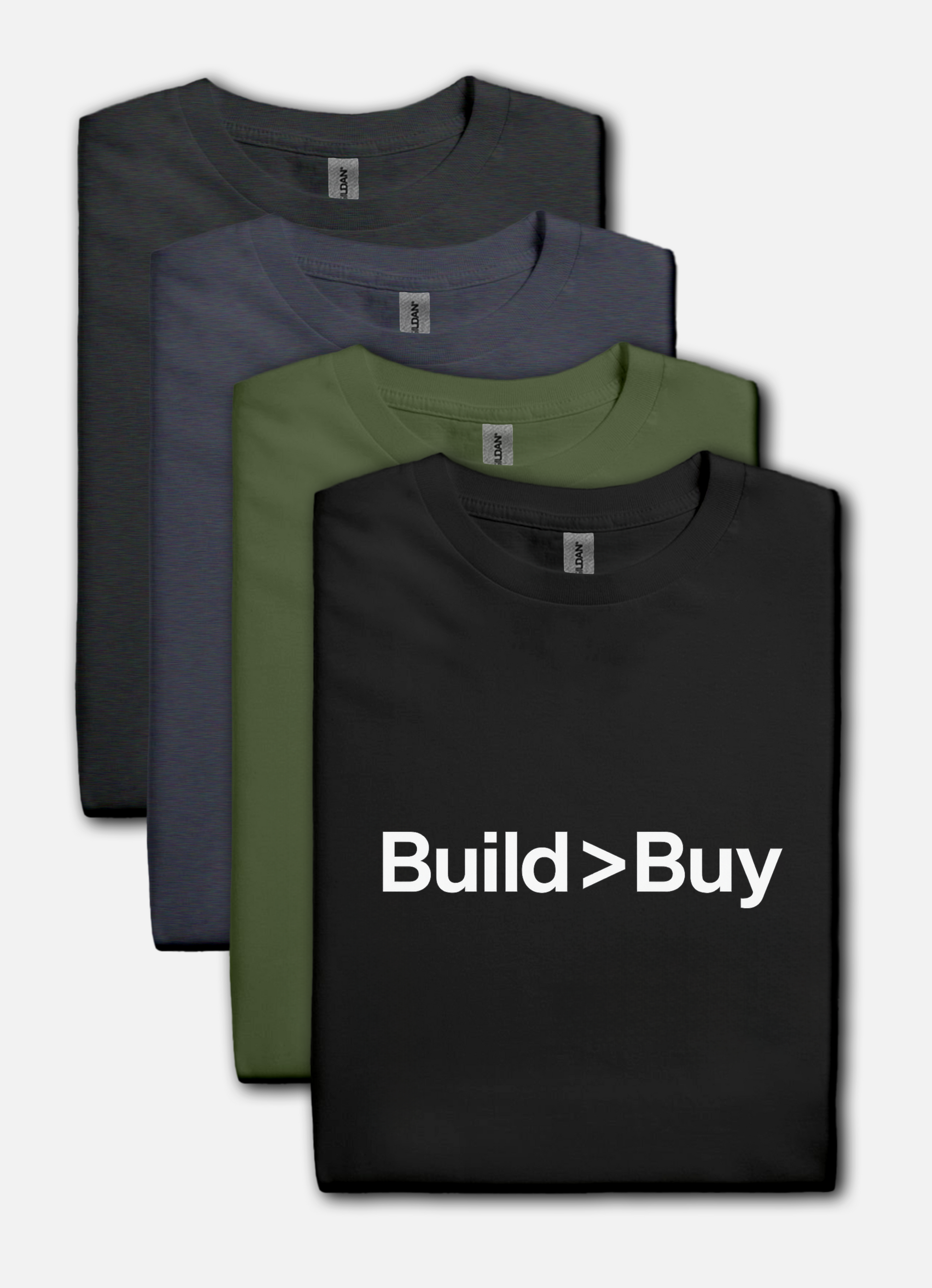 Four folded t-shirts in black, gray, and green with 'Build > Buy' text on a black shirt.