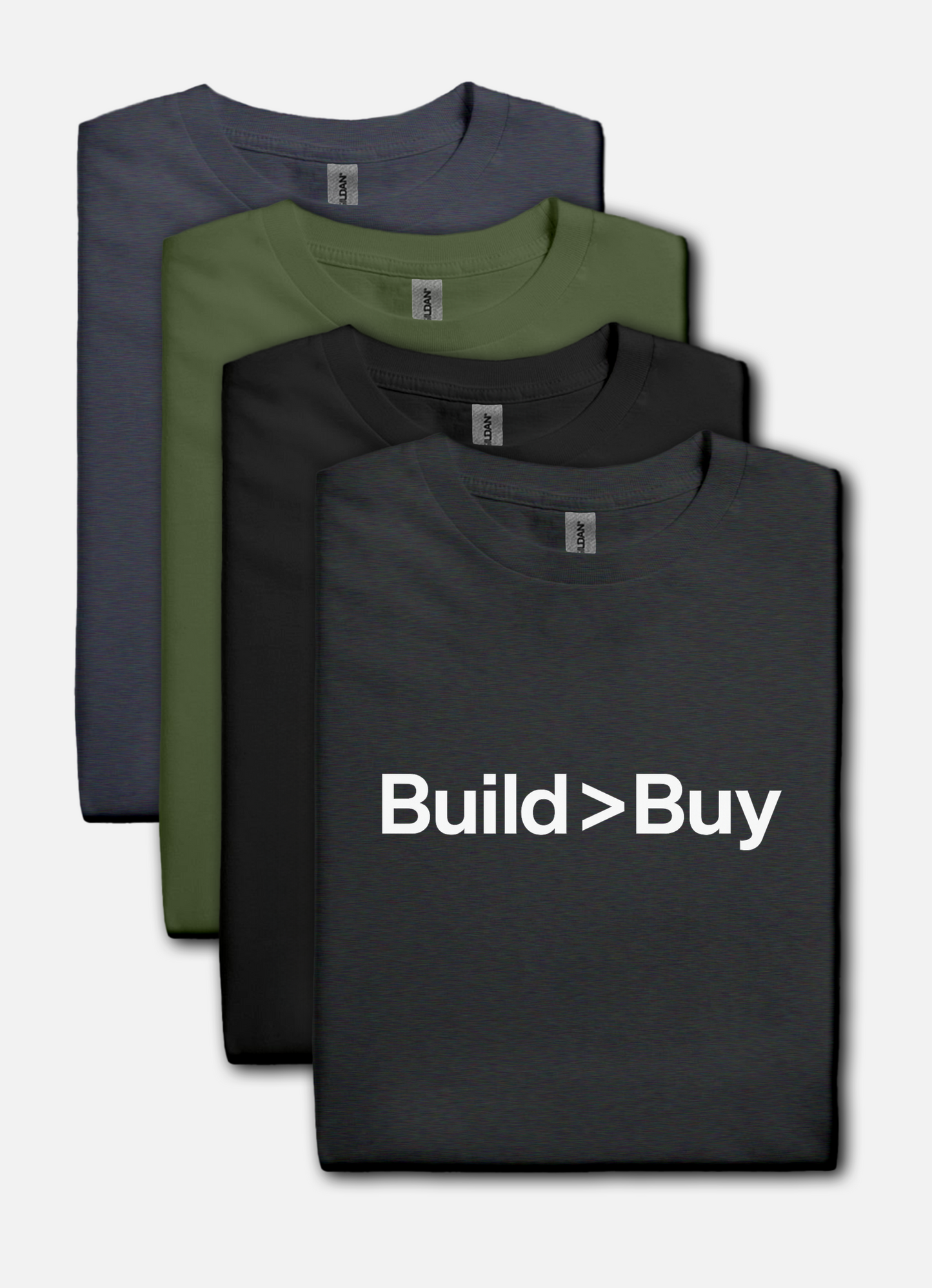 Four folded t-shirts in black, green, and gray with 'Build > Buy' text on a white background.