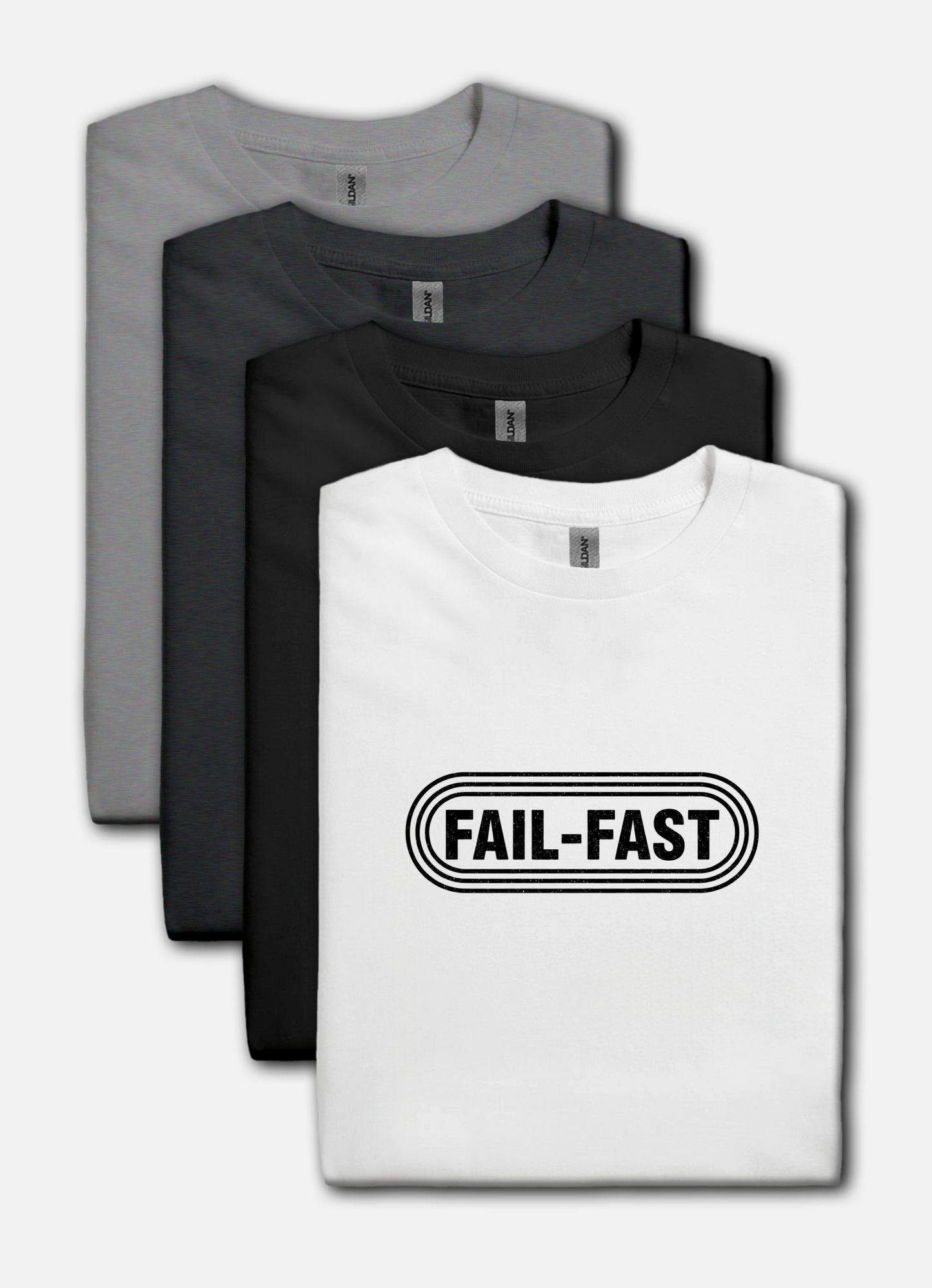 White t-shirt with 'FAIL-FAST' text, gray, black, and dark gray t-shirts stacked behind it.