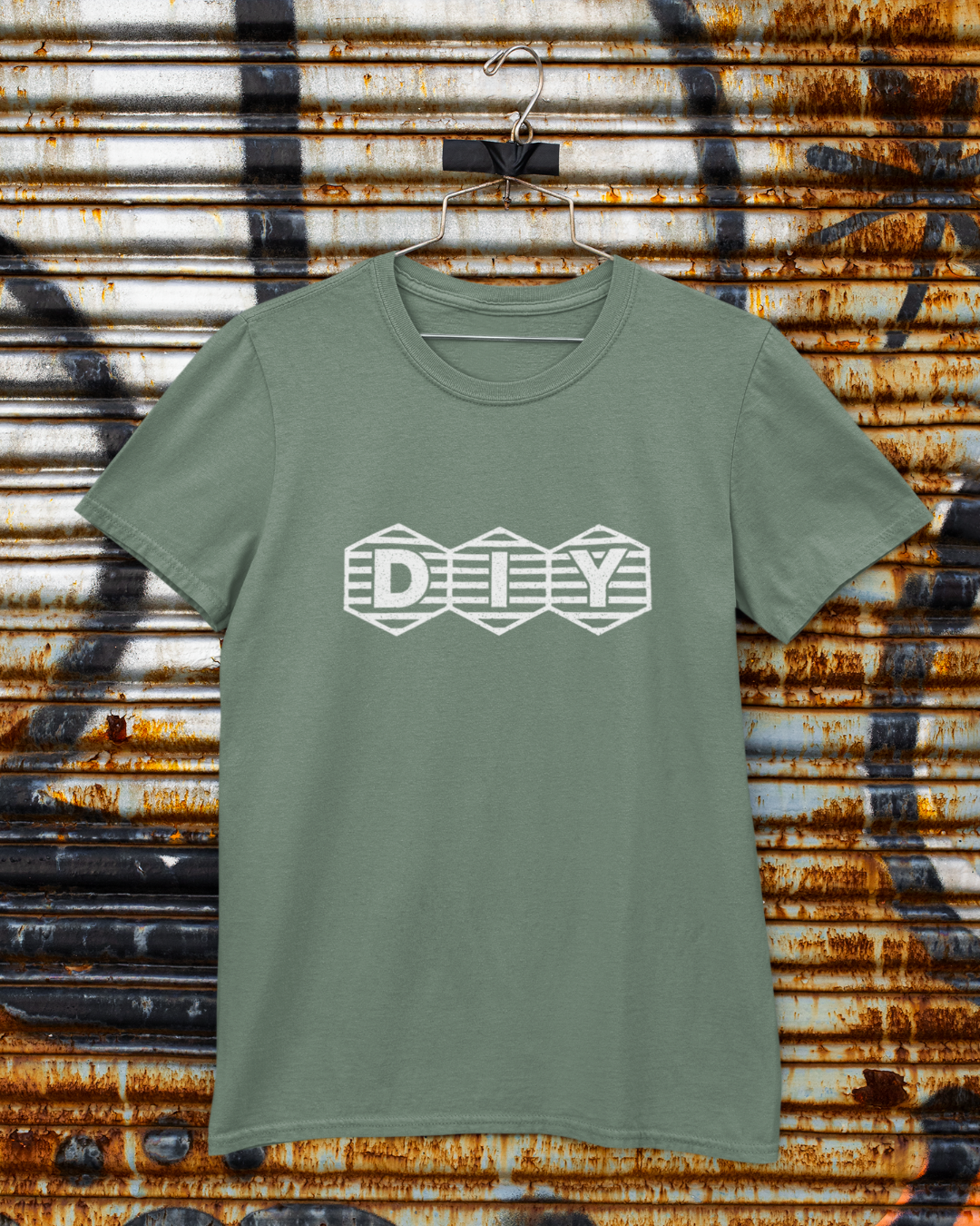 Military green t-shirt with print showing “DIY” inside three hex-shaped badges with horizontal stripes; clean retro maker logo.