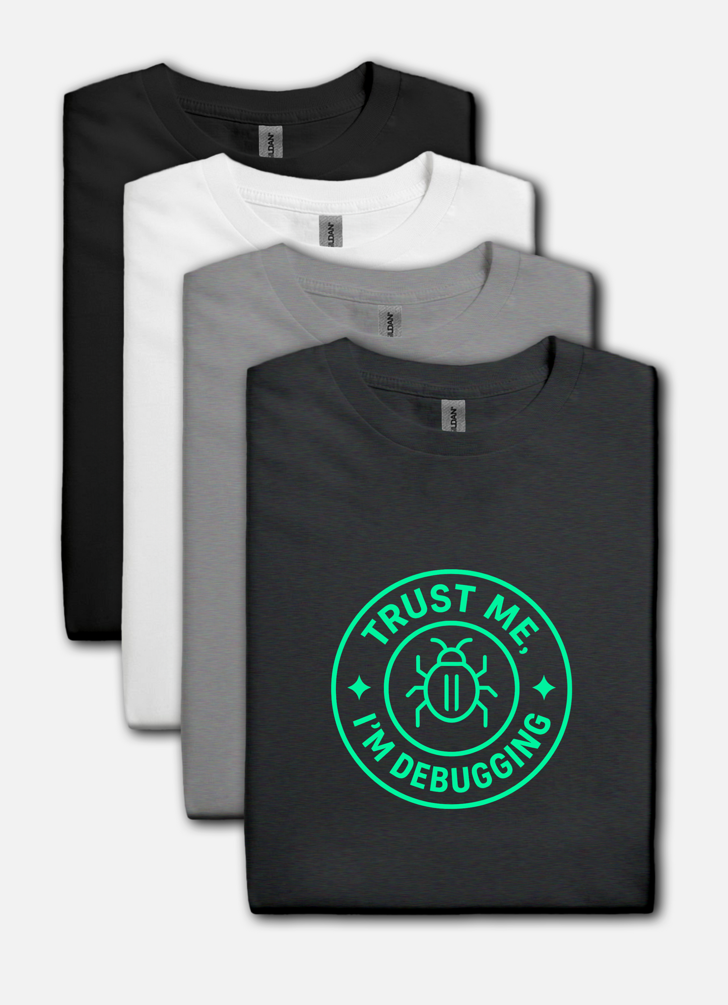 Four t-shirts in black, white, and gray with a green 'Trust Me, I'm Debugging' graphic on a black shirt.
