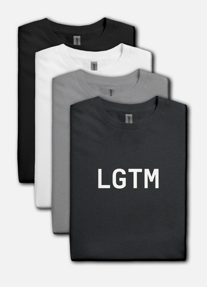 Four folded t-shirts in black, white, and gray with 'LGTM' text on a white background