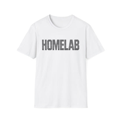 White t-shirt laid flat featuring a bold black “HOMELAB” wordmark with horizontal stripe/scanline effect; retro computer aesthetic with soft natural shadows.