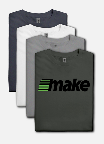 Charcoal t-shirt featuring a bold black MAKE wordmark with green speedline motif, inspired by the retro MECC logo behind The Oregon Trail.