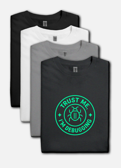 Four t-shirts in black, white, and gray with a green 'Trust Me, I'm Debugging' graphic on a black shirt.